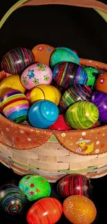 Basket of colorful Easter eggs against dark background.