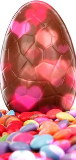 Chocolate Easter egg on colorful candy background.