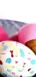 Colorful Easter eggs with pastel and gold decorations on a patterned surface.