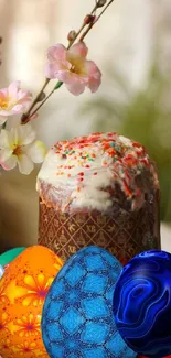 Colorful Easter eggs with spring blossoms in the background.