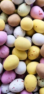 Colorful Easter eggs with pastel and speckled designs in a festive pattern.