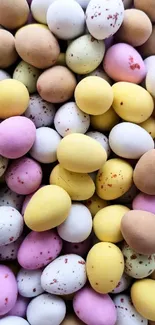 Assorted colorful pastel Easter eggs in a scattered pattern.