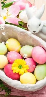 Colorful Easter eggs and ceramic bunny in a spring basket.