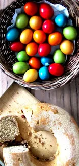 Vibrant Easter eggs in a wicker basket with a loaf of bread on a wooden table.