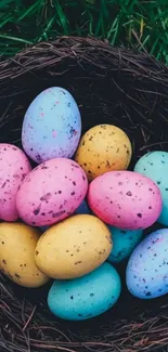 Colorful Easter eggs in a nest wallpaper for mobile.