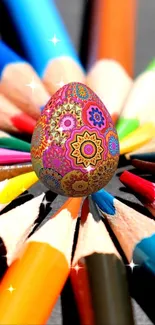 Colorful patterned egg with pencil tips in vibrant colors.