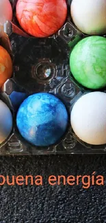 Colorful eggs with inspiring text on black background.