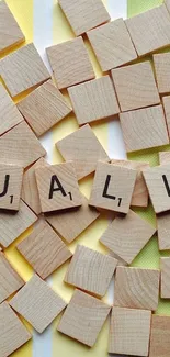 Equality spelled with wooden tiles on a colorful striped background mobile wallpaper.