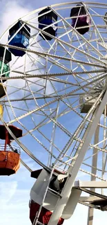 Colorful Ferris Wheel with blue sky background.