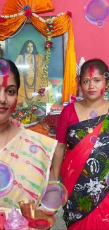 Women in traditional attire during a vibrant Indian festival celebration.