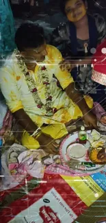 Man in traditional attire during a vibrant Indian ritual with colorful elements.