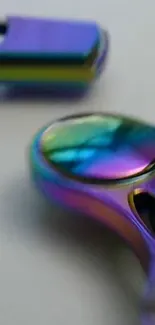 Close-up of colorful metallic fidget spinner with a shiny surface.