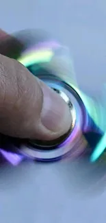 Colorful fidget spinner creating a blurred motion effect.