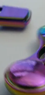 Close-up of rainbow metallic fidget spinner with vivid colors.