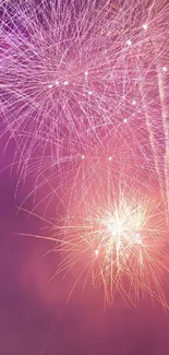 Vibrant fireworks against a bright purple sky, ideal for mobile wallpaper.