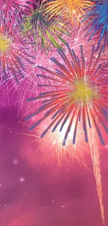 Vibrant fireworks burst over a purple sky, ideal for festive wallpaper.