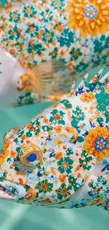 Vibrant fish wallpaper with colorful floral patterns.