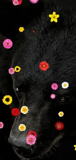 Black bear with colorful flowers on dark background wallpaper.