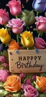 Vibrant birthday bouquet with colorful roses and 'Happy Birthday' sign.