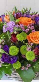 Vibrant floral bouquet with orange, purple, and green hues on a phone wallpaper.