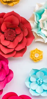 Colorful paper flower mobile wallpaper with red and blue hues.