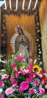 Sacred statue surrounded by vibrant flowers on wallpaper.