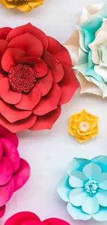 Colorful paper flower art with red, blue, and yellow petals.