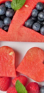 Heart-shaped watermelon with berries, creating a colorful fruit wallpaper.