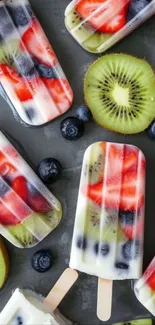 Colorful fruit popsicles with kiwi slices and berries.
