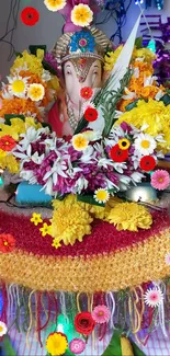 Vibrant Ganesh festival altar with colorful floral decor.