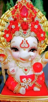 Vibrant Ganesh figurine with red and gold decorations.