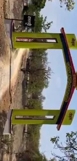 Vibrant yellow-green archway in natural setting