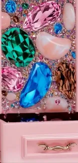 Colorful gemstones decorating a pink drawer.