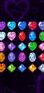 Colorful heart-shaped gemstones on a dark purple background.