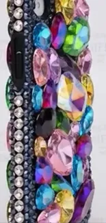 Gemstone-studded colorful phone case with vibrant design.