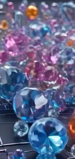 Blue, pink, and orange gemstones on a digital wallpaper.