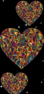 Three colorful geometric hearts on black background wallpaper.