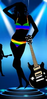 Silhouette of female guitarist with rainbow outfit on vibrant blue stage.