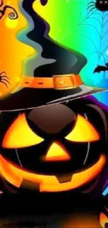 Halloween wallpaper with pumpkin and witch hat on colorful background.