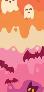 Colorful Halloween wallpaper with ghosts and bats under a peachy sky.