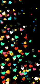 Colorful heart bokeh on a black background.