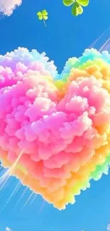 Vibrant heart-shaped rainbow cloud in a blue sky.