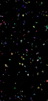 Colorful heart-shaped confetti on black background, perfect for mobile wallpaper.