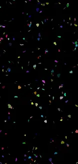 Mobile wallpaper with colorful heart confetti on a black background.