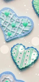 Pastel blue and green heart-shaped cookies pattern wallpaper.