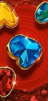 Colorful heart-shaped gemstones on a red background