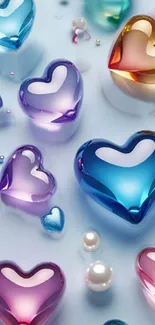 Colorful glass hearts on a light blue background, perfect for a vibrant phone wallpaper.