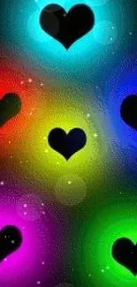 Vibrant wallpaper with glowing hearts in multiple colors on a dark background.