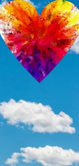 Colorful mosaic heart floating in a vibrant blue sky.