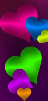 Mobile wallpaper with colorful hearts on a purple background.